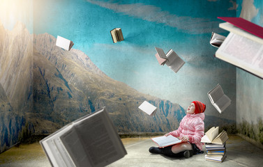 Little girl reading a book
