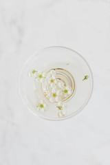 flowers in coupe champagne glass