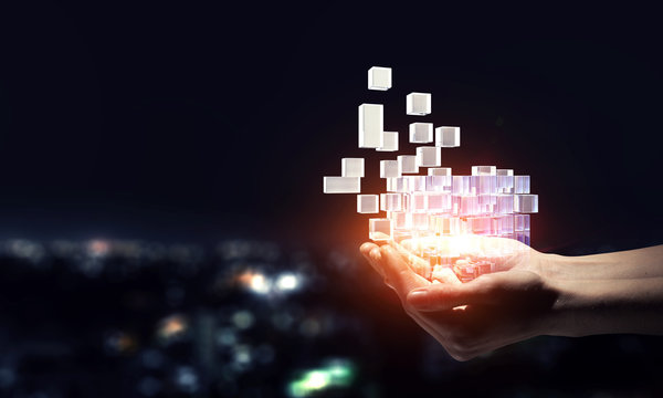 Hand holding glowing cubes. Innovation and creativity concept.