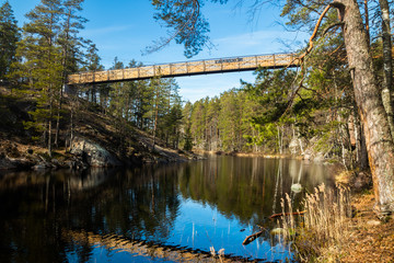 Fototapeta na wymiar New bridge over the lake Lapinsalmi in the National Park Repovesi, Finland