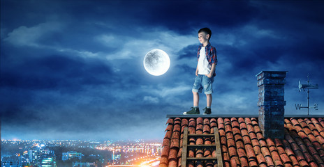 Boy on the roof and the moon.