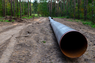Natural gas pipeline construction work. A dug trench in the ground for the installation and installation of industrial gas and oil pipes. Underground work project