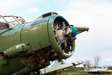 Old destroyed Soviet abandoned military airplanes in the field in Ukraine
