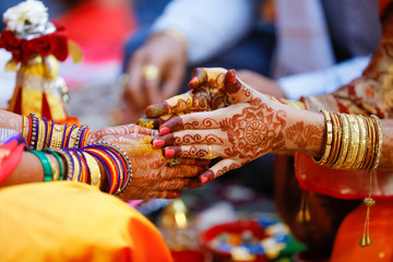 Indian wedding ceremony: bridal hand in haldi ceremony