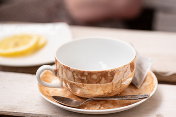 Empty cup for tea and lemon