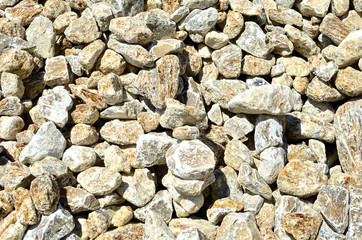 Natural gray gypsum stones. Gypsum stone is a soft sulfate mineral composed of calcium sulfate dihydrate. Industrial mining area. Limestone quarry with  crystals of selenite.