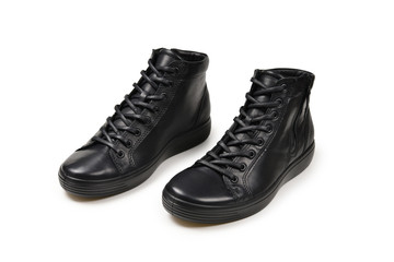 Men's black leather shoes and a black camera on a isolated on white background. Copy space.