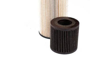 Old  and new oil filter isolated on white background.Copy space