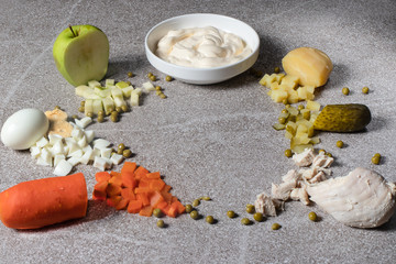Ingredients for Olivier Salad. Boiled chicken fillet, green peas, boiled potatoes, boiled carrots, pickled pickles, mayonnaise. green apples and chicken eggs.