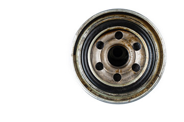 Old and dirty oil filter isolated on white background.Copy space