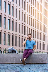 Fototapeta na wymiar Young businessman talking on his phone outdoors