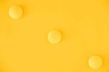Yellow balls on yellow background. Minimal concept. Top view. Copy, empty space for text