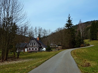 Fototapeta na wymiar Czech Republic - view of wooden house in Antonin valley in spring near town Svoboda n / U