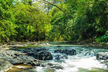 View on mountain river on Tegenungan waterfall on Bali
