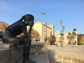 young woman sitting on the bench