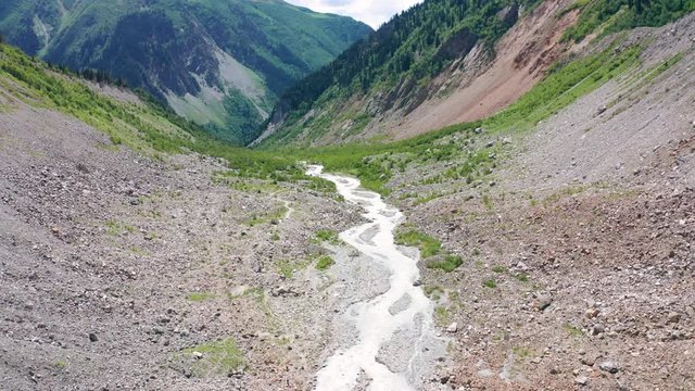 Caucasus Mountains on the border of Russia and Georgia. Chalaat Pass and Very beautiful view of the Chalaadi Glacier, Mount Ushba and Mestiachala river with background of clear blue sky.