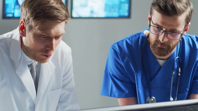 Professional medical doctors working in hospital office using computer technology. Medicine, neurosurgery and healthcare.