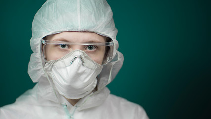 Female Doctor or Nurse Wearing Scrubs and Protective Mask and Goggles Banner.