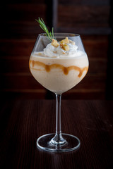 Banana smoothie with caramel Decorate with whipped cream and sprinkle with desserts.