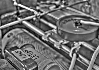 Inside view of high frequency power amplifier with capacitors, coils and other components in black and white