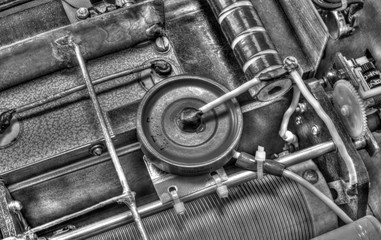 Inside view of high frequency power amplifier with capacitors, coils and other components in black and white