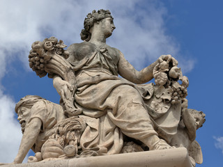 Antique statue in the park of Versailles palace near Paris, France