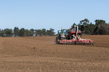 Fototapeta premium In the midst of the global corona pandemic, farmers worldwide are still working hard growing next years crop and ensuring the food supply lines can continue