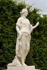 Antique statue in the park of Versailles palace near Paris, France