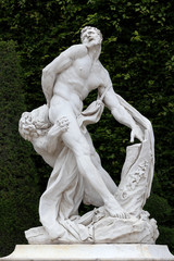 Antique statue in the park of Versailles palace near Paris, France