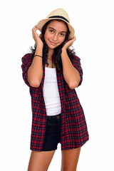 Studio shot of young beautiful teenage girl isolated against white background
