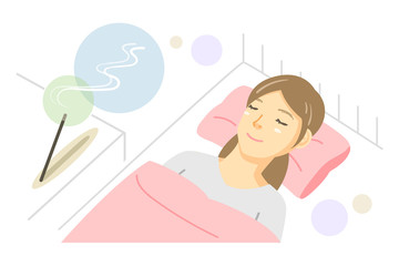 就寝時にお香を焚いて眠る女性（スティック香・スティック型）