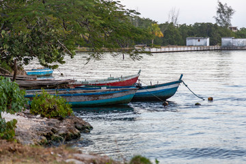 Fototapeta na wymiar Some boats are floating in the pier of Playa Larga, a little town in the south of Cuba