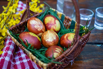 traditional Easter eggs in basket painted by boiling in red onion leaves - organic food