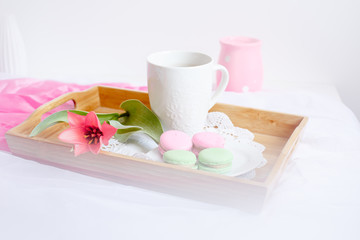 romantic morning greeting card.a Cup of morning tea with macaroons and a flower