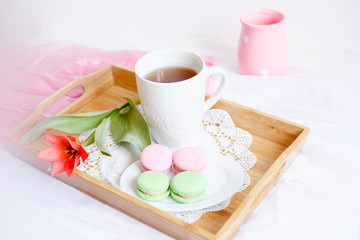romantic morning greeting card.a Cup of morning tea with macaroons and a flower