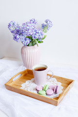 romantic morning greeting card.a Cup of morning tea with macaroons and a flower