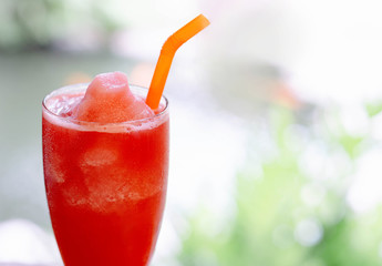 Closeup watermelon smoothie on wood table, selective focus