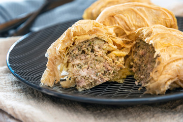 Blanched cabbage leaves surrounding a pork and turkey preparation and soy protein
