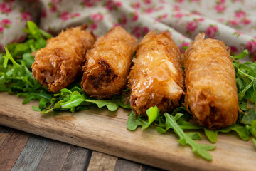 pork spring rolls Rice cakes stuffed with a pork stuffing accompanied by sauce