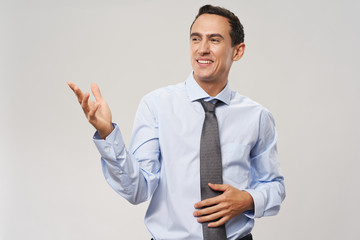 young businessman showing thumbs up