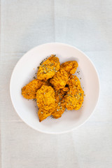 Chicken Wings Spicy chicken wings, breaded, fried, cooked.