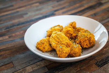 Chicken Wings Spicy chicken wings, breaded, fried, cooked.