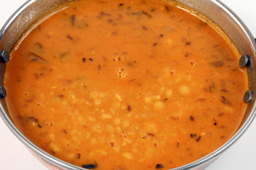 indian style dal lentil tarka spicy ghee fried dish in brass karai bowl pan top view