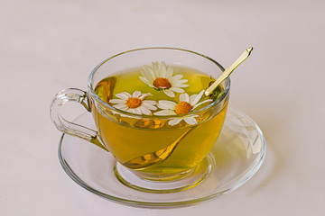 Chamomile flowers and chamomile tea in cup