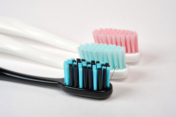 Colorful toothbrushes close-up on a white background. Oral hygiene. care for the oral cavity