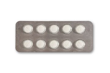 White pills in the silver medicine panel on a white background