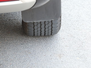 Black wheels on the road surface