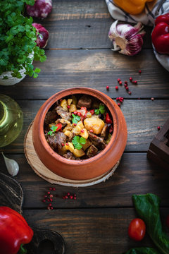 Roast in a clay pot. Braised beef with vegetables. A dish of Georgian cuisine. Chanahi