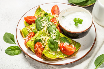 Green pancakes from spinach on white.