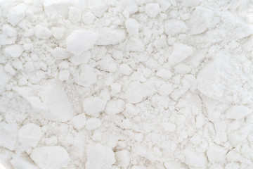 Fototapeta na wymiar Powdered milk. White abstract texture. Light uneven rough background.